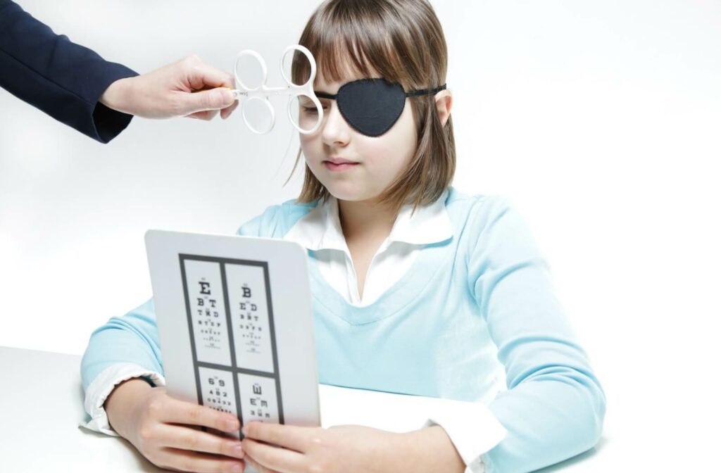 A young person undergoes vision therapy for their lazy eye.